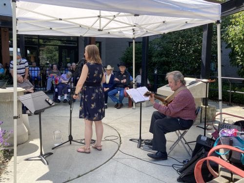 Residents of Foyer Maillard enjoying a live music performance